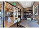 Cozy reading room with comfortable chairs, a table and a bookshelf full of books at 23781 Waverly Cir, Venice, FL 34293