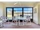 Screened-in balcony overlooking picturesque views of a pond and the community's outdoor area at 409 Pine Hollow Cir # 409, Englewood, FL 34223