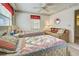 Cozy bedroom featuring two twin beds, a comfortable couch, and soft, inviting decor at 409 Pine Hollow Cir # 409, Englewood, FL 34223