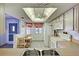 Well-lit eat-in kitchen featuring tile flooring, white appliances, window with curtain, and a ceiling fan at 409 Pine Hollow Cir # 409, Englewood, FL 34223