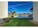 Tranquil water view from a private lanai, showcasing the scenic community and lush landscaping at 409 Pine Hollow Cir # 409, Englewood, FL 34223