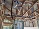 View of attic showing wood framework and the newly installed spray foam insulation at 418 Rotonda Cir, Rotonda West, FL 33947
