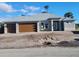 New home featuring a stucco exterior, gray roof, and a two-car garage with a modern wood-look door at 418 Rotonda Cir, Rotonda West, FL 33947