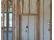 Interior wall framing featuring insulation, wiring, and window placements at 418 Rotonda Cir, Rotonda West, FL 33947