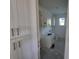 Well-lit utility room featuring white cabinets, a sink, and ample storage space at 418 Rotonda Cir, Rotonda West, FL 33947