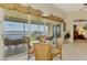 Bright dining area with water view and access to outdoor patio at 4624 Club Dr # G201, Port Charlotte, FL 33953