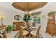 Dining room with glass table, tropical decor, unique ceiling detail, and decorative furnishings at 4624 Club Dr # G201, Port Charlotte, FL 33953