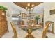 Elegant dining area adjacent to the kitchen, with tropical decor and furnishings at 4624 Club Dr # G201, Port Charlotte, FL 33953