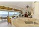 Open kitchen featuring granite counters, stainless appliances, and expansive water views from the breakfast nook at 4624 Club Dr # G201, Port Charlotte, FL 33953