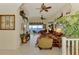 Spacious living room with high ceilings, tile flooring, stylish furniture, and stunning water views at 4624 Club Dr # G201, Port Charlotte, FL 33953