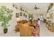 Bright living room with tile floors, comfortable furniture, and an open layout at 4624 Club Dr # G201, Port Charlotte, FL 33953