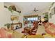 Cozy living room with tile floors, water views, comfortable seating, and natural light at 4624 Club Dr # G201, Port Charlotte, FL 33953