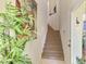 Bright staircase with carpeted steps and white railing, leading to the upper level of the home at 4624 Club Dr # G201, Port Charlotte, FL 33953