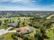 Picture of beautiful property with a pool and verdant landscaping at 48 Par View Ct, Rotonda West, FL 33947
