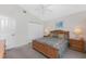 Bright bedroom with a ceiling fan, a closet with white doors, and neutral walls at 48 Par View Ct, Rotonda West, FL 33947