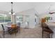 Bright breakfast nook with a view of the pool and a doorway to the kitchen at 48 Par View Ct, Rotonda West, FL 33947