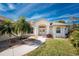 Elegant home entrance with double doors, columns, and meticulously maintained landscaping at 48 Par View Ct, Rotonda West, FL 33947