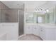 Spacious bathroom with large vanity, tile flooring, and a glass-enclosed shower at 48 Par View Ct, Rotonda West, FL 33947