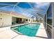 Enclosed pool with turquoise water and outdoor seating offers a relaxing retreat with a bright sunny view at 48 Par View Ct, Rotonda West, FL 33947