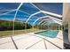 An inviting screened-in pool is surrounded by a spacious deck, ideal for outdoor relaxation and entertaining at 48 Par View Ct, Rotonda West, FL 33947