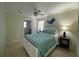 Inviting bedroom with ensuite bathroom and a serene ambiance enhanced by soft lighting at 5262 Weatherton St, North Port, FL 34288
