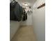 Walk-in closet with shelving for organization and storage of clothing at 5262 Weatherton St, North Port, FL 34288