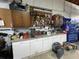 Well-organized garage workbench with cabinets, tools, and ample storage, providing a practical workspace at 5262 Weatherton St, North Port, FL 34288