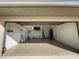Clean, organized garage with epoxy flooring, shelving, and a door to the house for easy access at 5262 Weatherton St, North Port, FL 34288