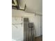Garage with a mini split AC system, shelving, and building materials at 5262 Weatherton St, North Port, FL 34288