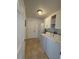 Convenient laundry room offers a washer and dryer plus extra storage at 5262 Weatherton St, North Port, FL 34288