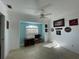 Well-lit living room has tiled floors and a fan at 5262 Weatherton St, North Port, FL 34288