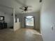Inviting entryway with neutral tile flooring, double doors, and ceiling fan at 5262 Weatherton St, North Port, FL 34288