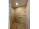 Neutral-toned tiled walk-in shower features two horizontal grab bars at 5262 Weatherton St, North Port, FL 34288