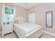 Bedroom featuring a double bed, nightstand and white furniture at 59 Long Meadow Ln, Rotonda West, FL 33947