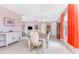 Inviting dining area with tile floors and views into the kitchen and living spaces at 59 Long Meadow Ln, Rotonda West, FL 33947