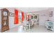 Charming dining area with a view of the open living space and tile flooring throughout at 59 Long Meadow Ln, Rotonda West, FL 33947