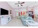 Inviting living room with tile flooring, comfortable seating, and an open layout to the kitchen at 59 Long Meadow Ln, Rotonda West, FL 33947