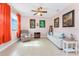 Cozy living room with tile floors, comfortable seating, and natural light from the window at 59 Long Meadow Ln, Rotonda West, FL 33947