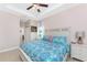 Main bedroom features a queen bed, two nightstands, and access to the bathroom at 59 Long Meadow Ln, Rotonda West, FL 33947