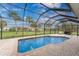 The backyard features a screened-in pool, brick pavers, and tropical landscaping at 59 Long Meadow Ln, Rotonda West, FL 33947