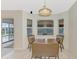 Dinette with backyard views and dining table near sliding door at 7151 Cork Ln, Englewood, FL 34224