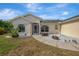 Inviting front entrance with decorative rock landscaping at 7151 Cork Ln, Englewood, FL 34224