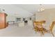 Open-concept living room and dining area at 7151 Cork Ln, Englewood, FL 34224