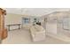 Bright living room flows into the kitchen and dining area, creating an open and inviting space at 7151 Cork Ln, Englewood, FL 34224