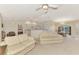 Bright living room open to the kitchen and dining area, perfect for entertaining and Gathering gatherings at 7151 Cork Ln, Englewood, FL 34224