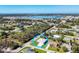 An aerial view shows this home's location near a lake in a relaxed, lovely neighborhood at 7499 Ashtabula St, Englewood, FL 34224