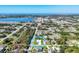 A distant aerial view shows the location near a lake and the ocean of this charming neighborhood at 7499 Ashtabula St, Englewood, FL 34224