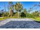 Spacious patio area, perfect for entertaining, with lush tropical surroundings at 7499 Ashtabula St, Englewood, FL 34224