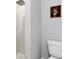 Modern bathroom with a tiled walk-in shower and a clean, efficient toilet at 7499 Ashtabula St, Englewood, FL 34224