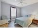 Cozy bedroom with a calming color scheme and a large window at 7499 Ashtabula St, Englewood, FL 34224